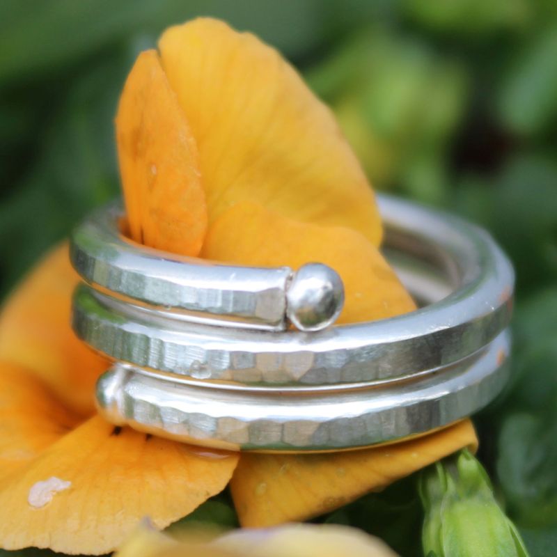 Silver spiral ring with hammered surface and silver balls